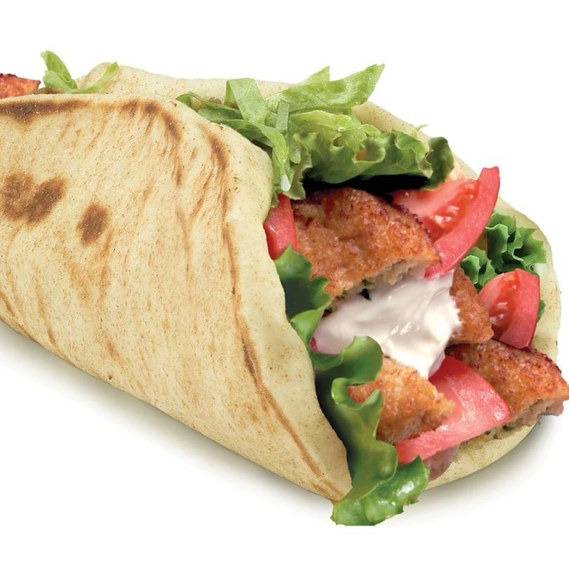 Gyro Wrap's gyro with crispy meat, fresh lettuce, tomatoes, and white sauce in pita bread.